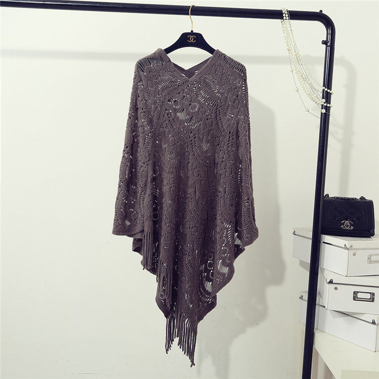 Women's Crochet Poncho with Fringed Edges and Fine Openwork Pattern