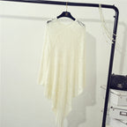 Women's Crochet Poncho with Fringed Edges and Fine Openwork Pattern