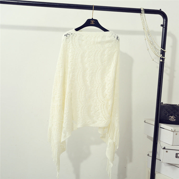 Women's Crochet Poncho with Fringed Edges and Fine Openwork Pattern