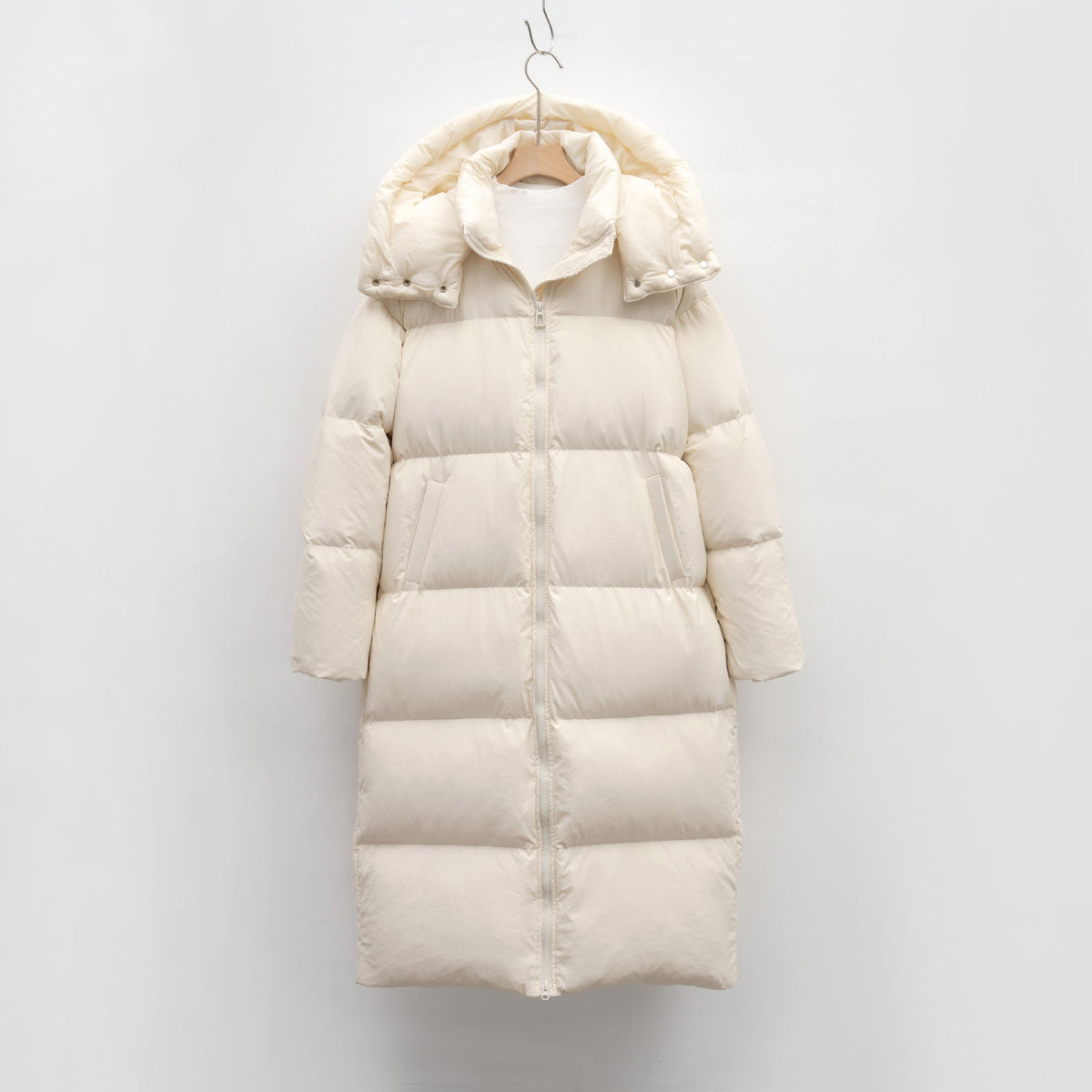 Women's Long Voluminous Down Coat with Detachable Hood and Side Pockets