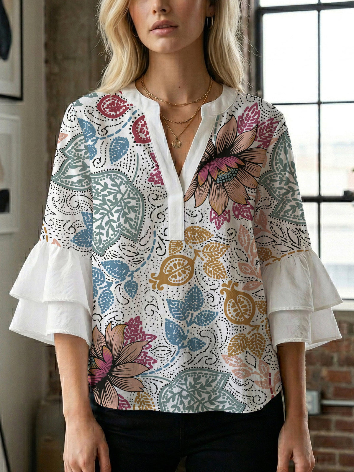 Women's Blouse with Voluminous Ruffle Sleeves and Floral Design