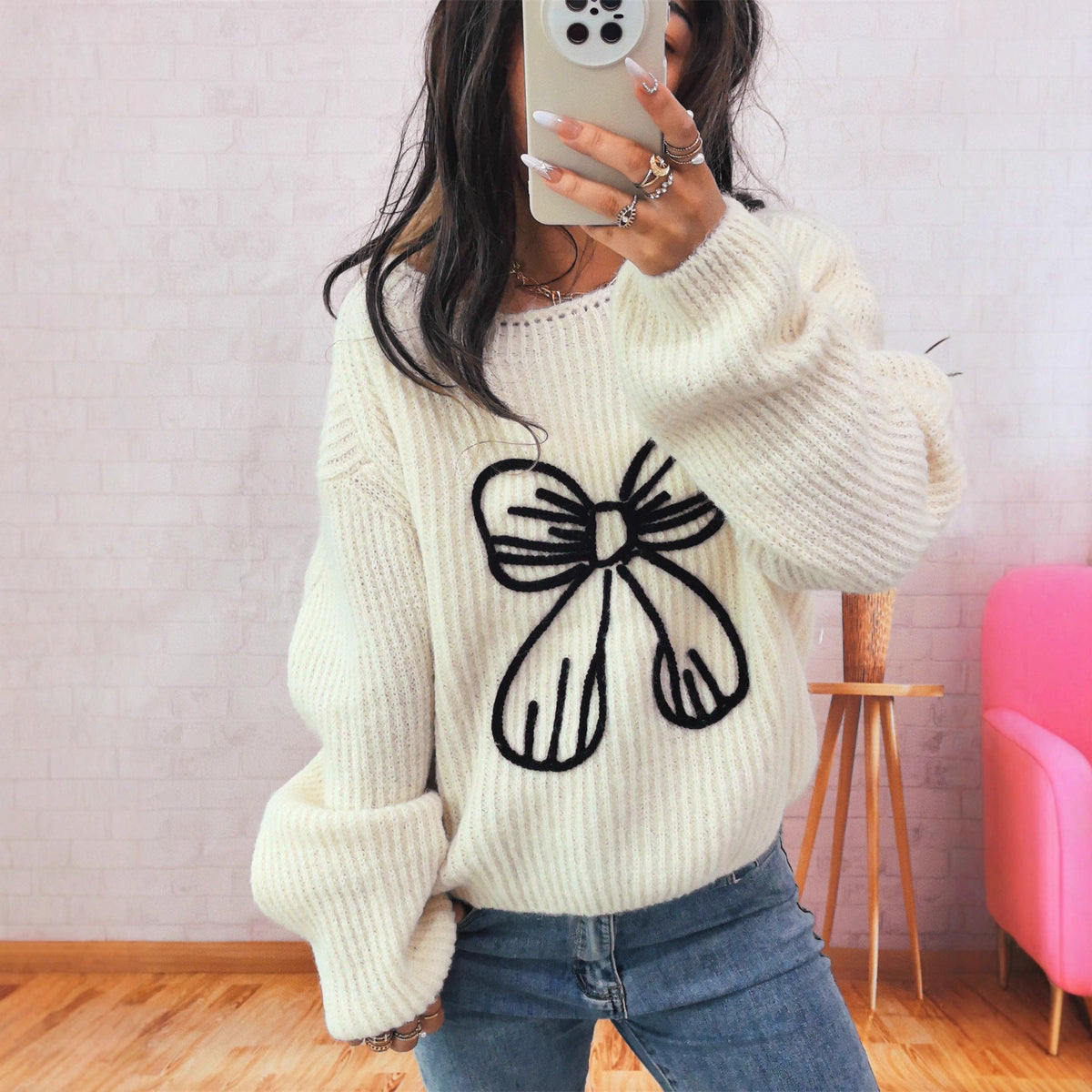Women's Chunky Knit Sweater with Playful Bow Motif