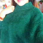 Women's fluffy turtleneck pullover with puff sleeves and textured design