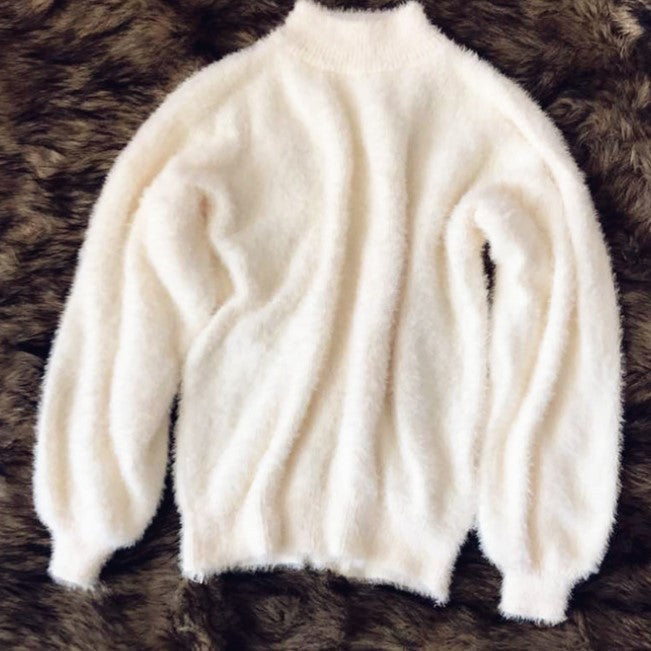 Women's fluffy turtleneck pullover with puff sleeves and textured design
