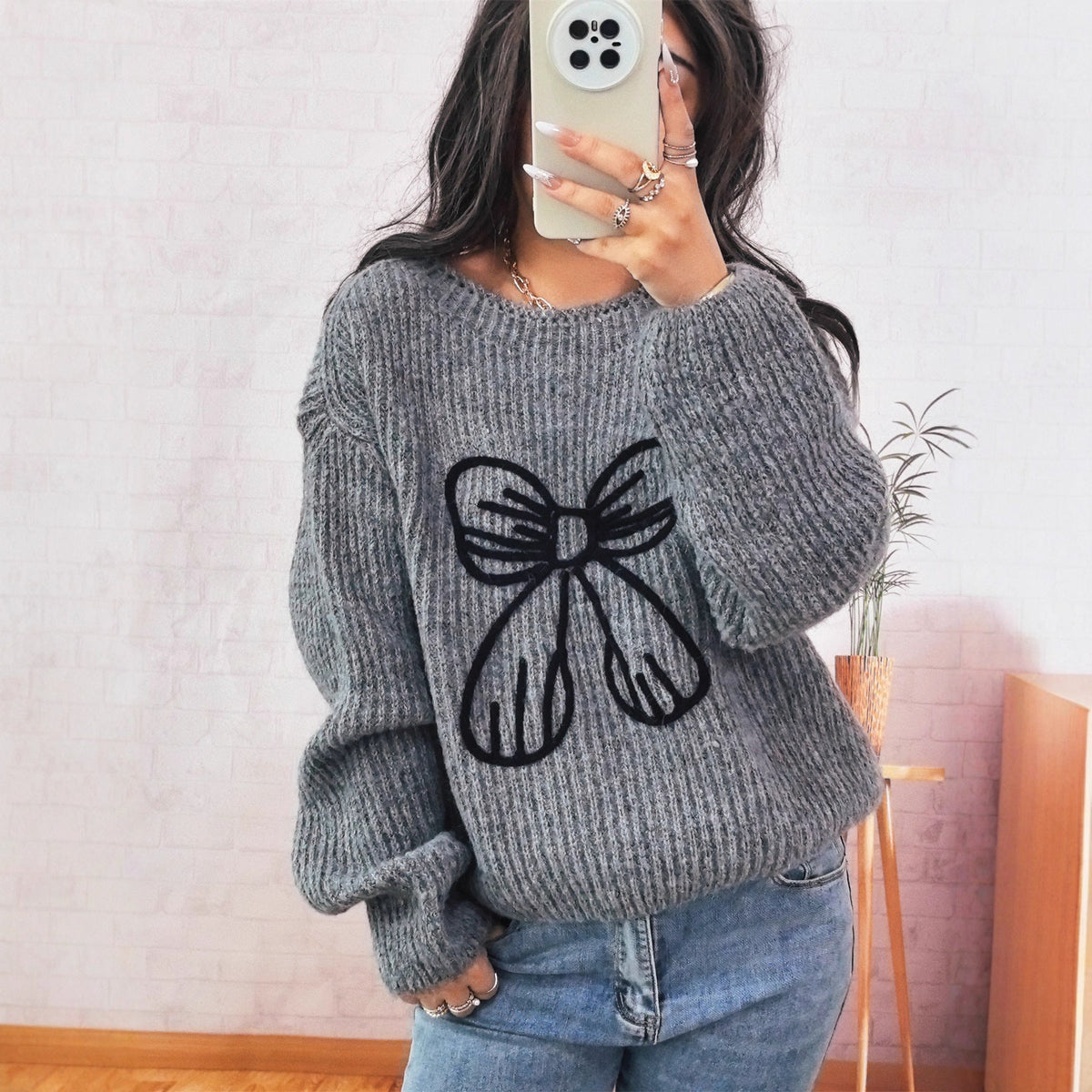 Women's Chunky Knit Sweater with Playful Bow Motif