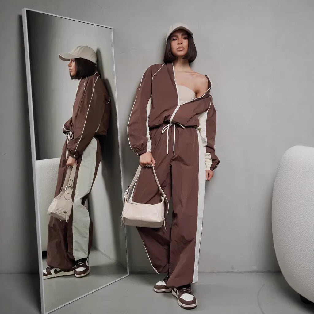 Women's sporty-elegant track set with stand-up collar, zip jacket, and wide side stripe trousers