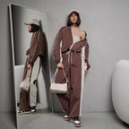 Women's sporty-elegant track set with stand-up collar, zip jacket, and wide side stripe trousers