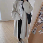 Women's Minimalist Long Wool Coat with Wide Cut and Elegant Details