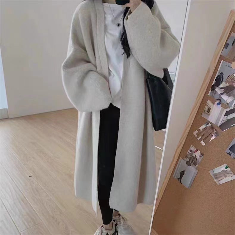 Women's Minimalist Long Wool Coat with Wide Cut and Elegant Details