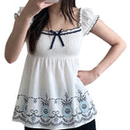 Women's Cotton Blouse with Floral Embroidery and Ruffled Hem