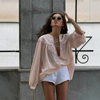 Airy Blouse with Ruffle Details and Decorative Lacing
