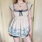 Women's Cotton Blouse with Floral Embroidery and Ruffled Hem