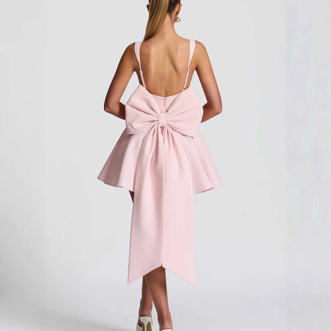 Women's Cocktail Dress with Oversized Bow Design and Flowing Skirt