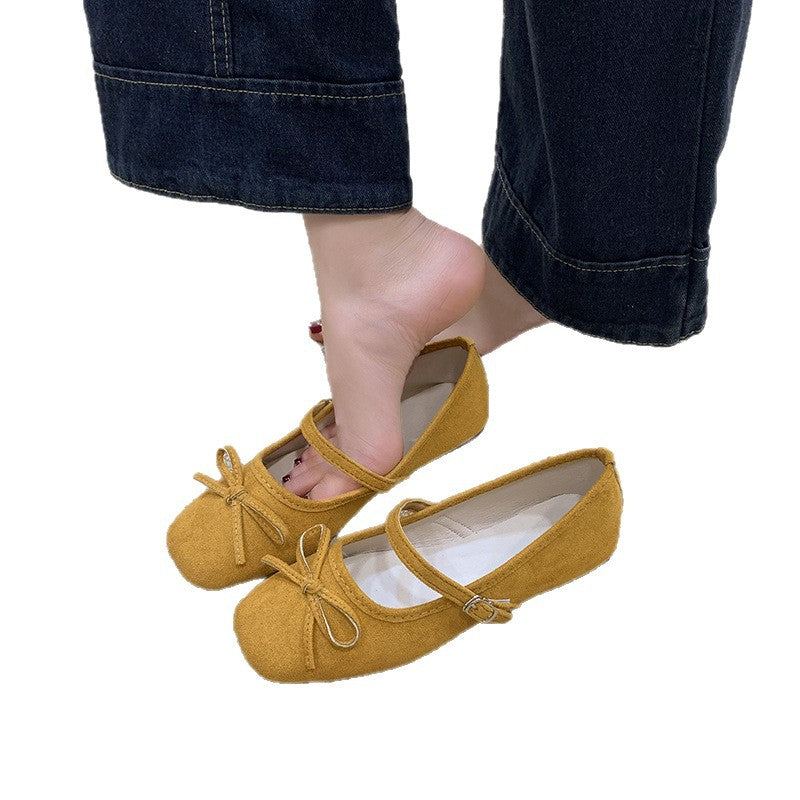 Women's ballet flats with decorative bow accent and comfortable adjustable strap