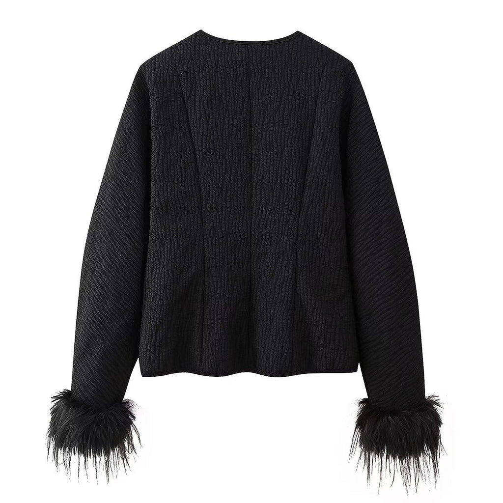 Elegant Quilted Jacket with Ruffle Details and High Collar