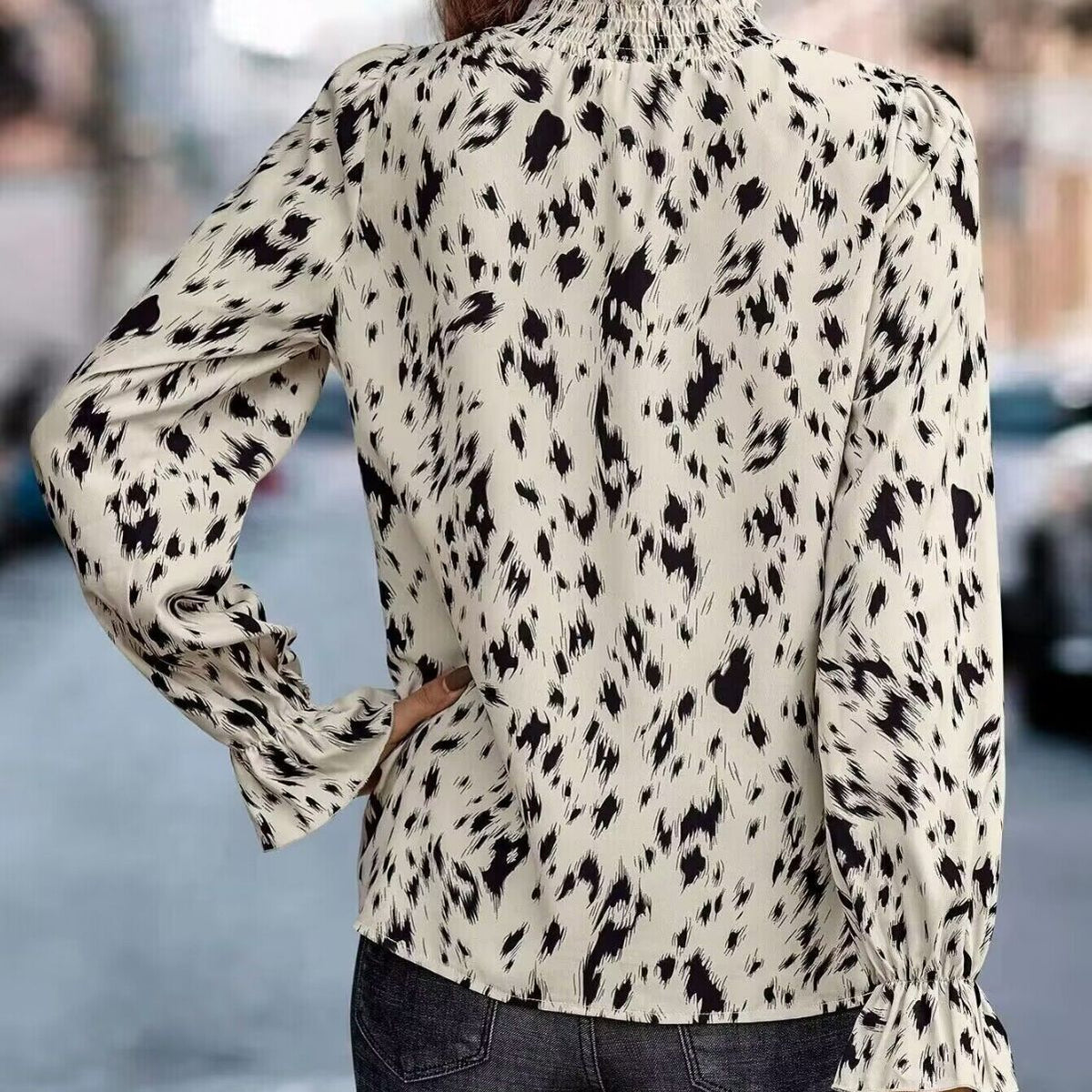 Elegant Women's Blouse with Ruffle Hem and Asymmetrical Pattern