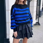 Women's Cozy Knit Sweater with Cable Knit Pattern and Graphic Accents