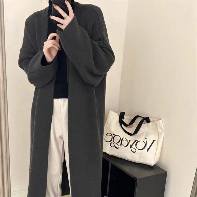 Women's Minimalist Long Wool Coat with Wide Cut and Elegant Details