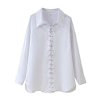 Blouse with Ruffle Design and Elegant Lacing