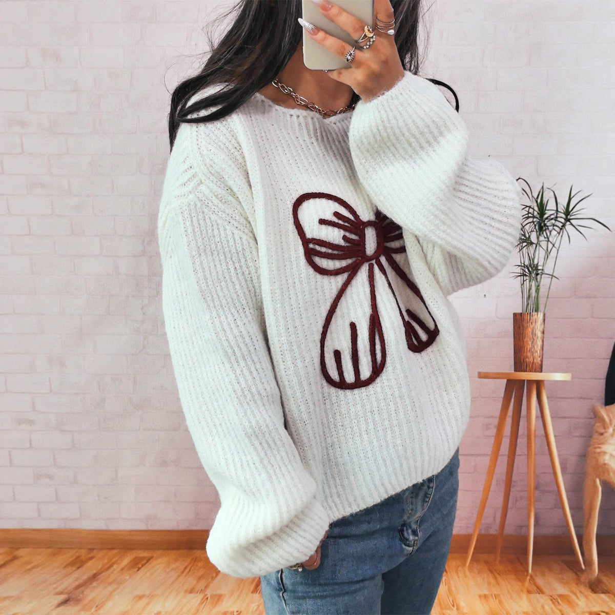 Women's Chunky Knit Sweater with Playful Bow Motif