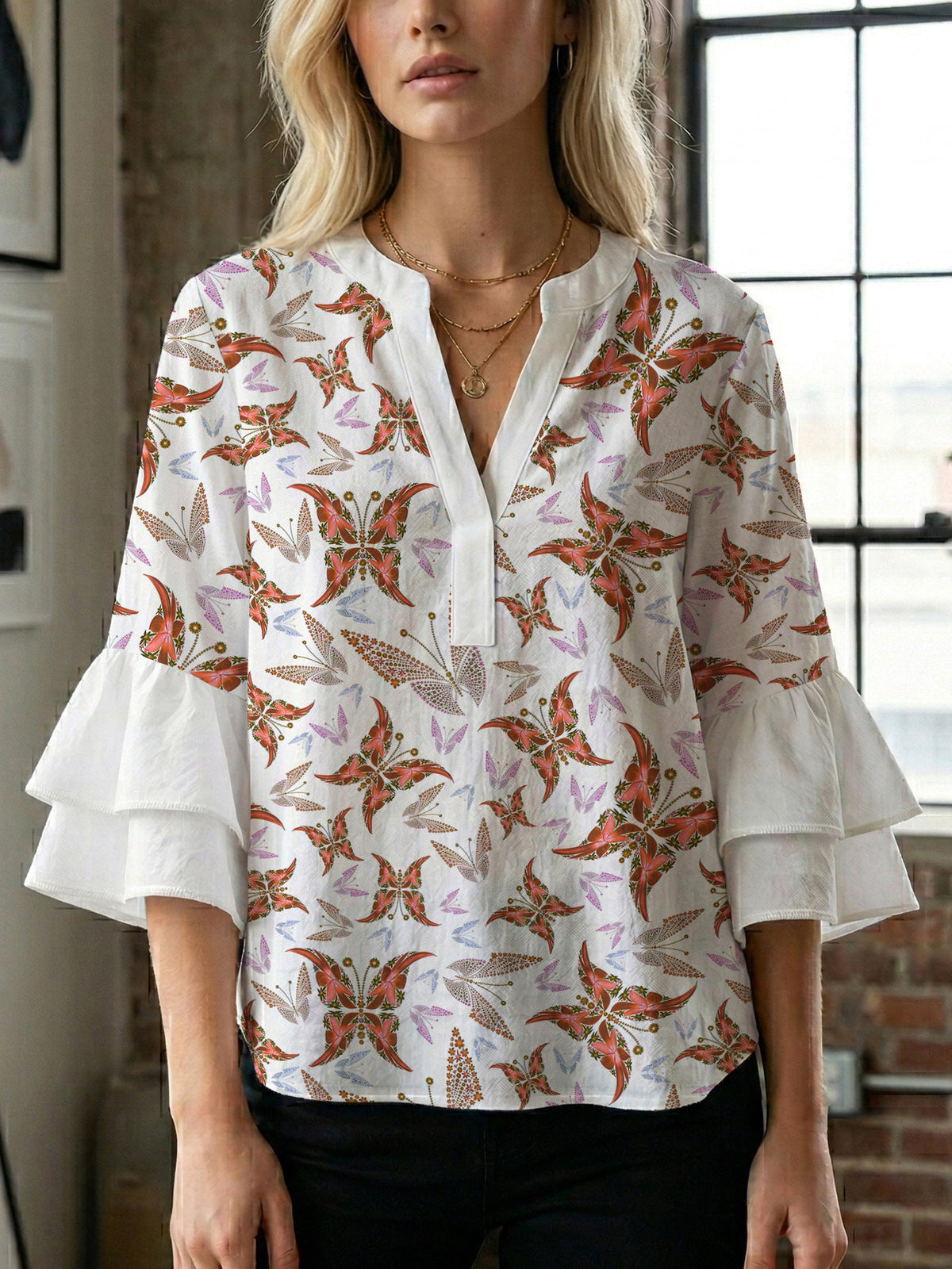 Women's Blouse with Voluminous Ruffle Sleeves and Floral Design