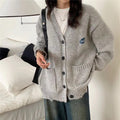 Women's Chunky Knit Cardigan with Pockets and Button Details