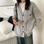 Women's Chunky Knit Cardigan with Pockets and Button Details