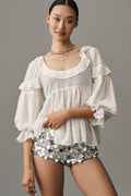 Women's Blouse with Decorative Ruffles and Textured Fabric