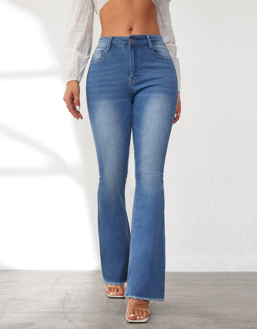 Women's High-Waisted Flared Jeans with Fringed Hems