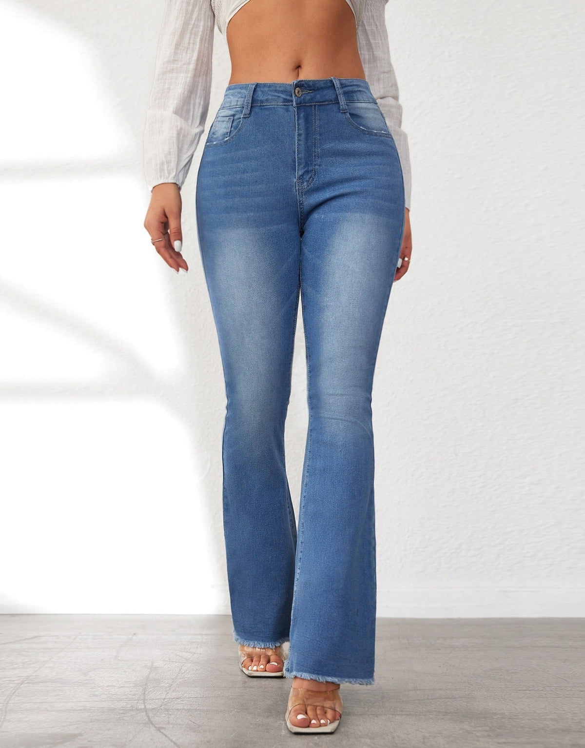 Women's High-Waisted Flared Jeans with Fringed Hems