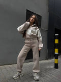 Women's athleisure two-piece made of heavy neoprene fleece with geometric dividing seams and high waist