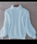 Women's fluffy turtleneck pullover with puff sleeves and textured design