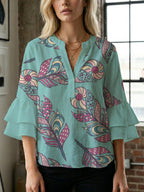 Women's Blouse with Voluminous Ruffle Sleeves and Floral Design