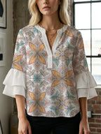 Women's Blouse with Voluminous Ruffle Sleeves and Floral Design
