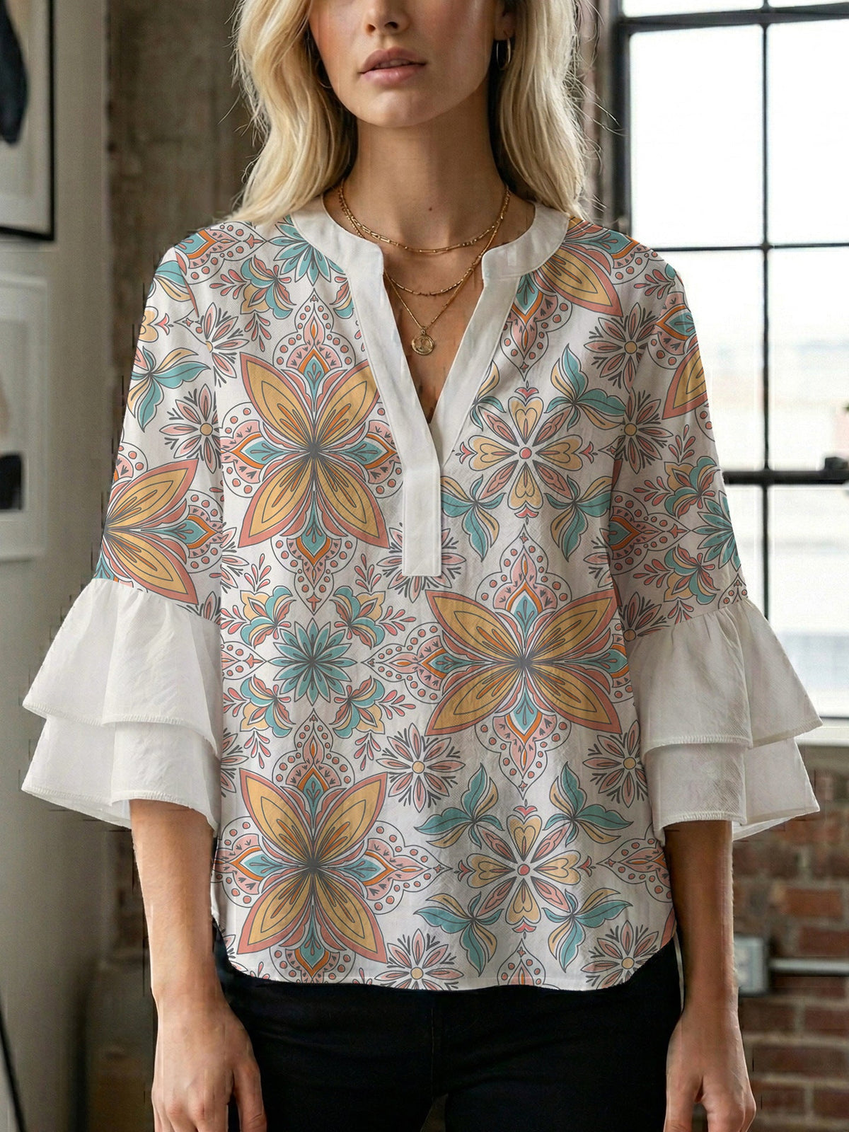 Women's Blouse with Voluminous Ruffle Sleeves and Floral Design