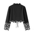 Elegant Blouse with Floral Embroidery and Ruffles