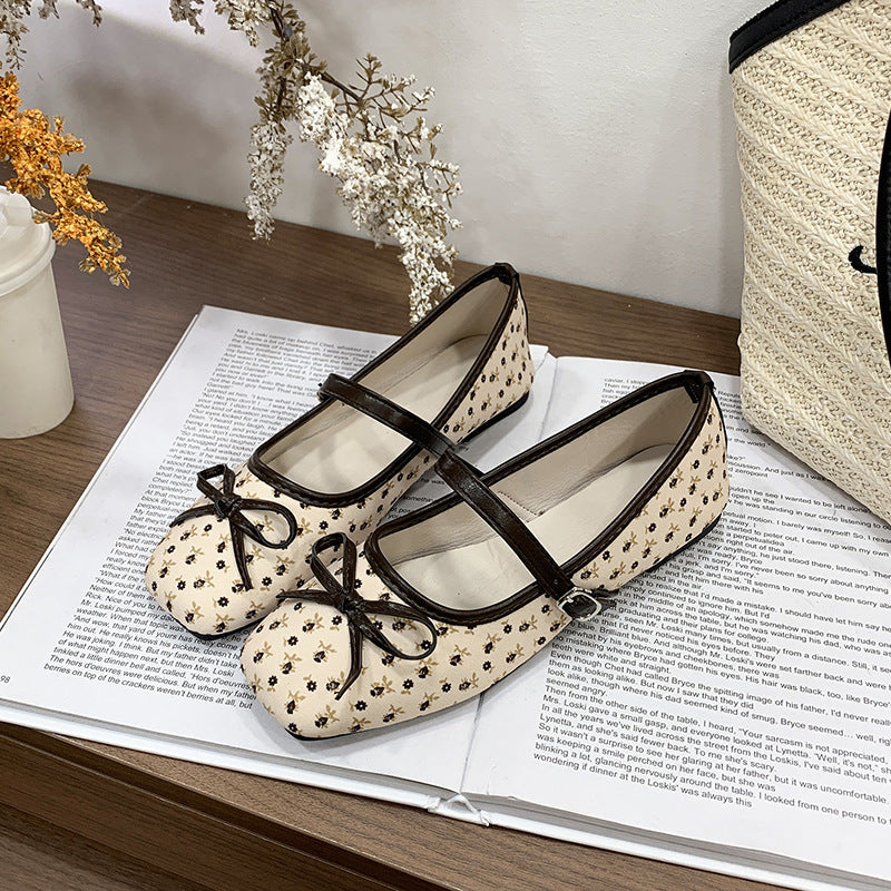 Women's ballet flats with decorative bow accent and comfortable adjustable strap