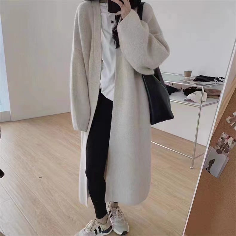 Women's Minimalist Long Wool Coat with Wide Cut and Elegant Details