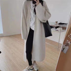 Women's Minimalist Long Wool Coat with Wide Cut and Elegant Details