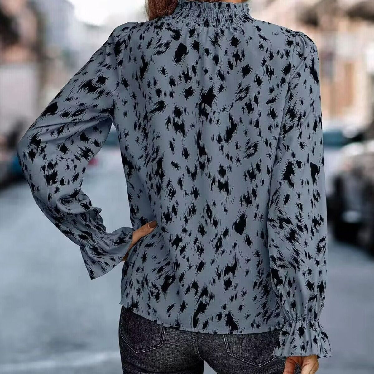 Elegant Women's Blouse with Ruffle Hem and Asymmetrical Pattern