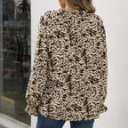 Women's Blouse with Unique Animal Print and Ruffle Details