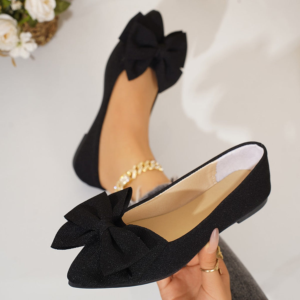 Ladies elegant lace ballerinas with large decorative bow and shimmering upper material