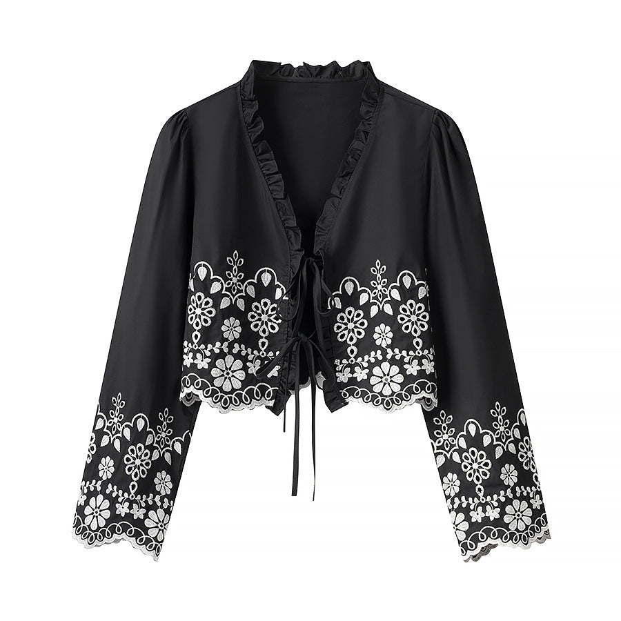Elegant Blouse with Floral Embroidery and Ruffles