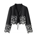 Elegant Blouse with Floral Embroidery and Ruffles