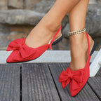 Ladies elegant lace ballerinas with large decorative bow and shimmering upper material