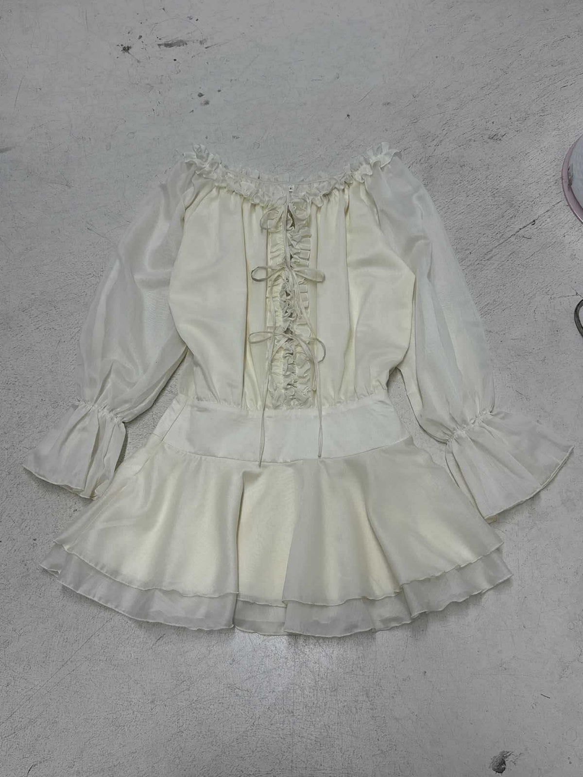 Women's Blouse with Ruffle Details and Lace-Up Accents
