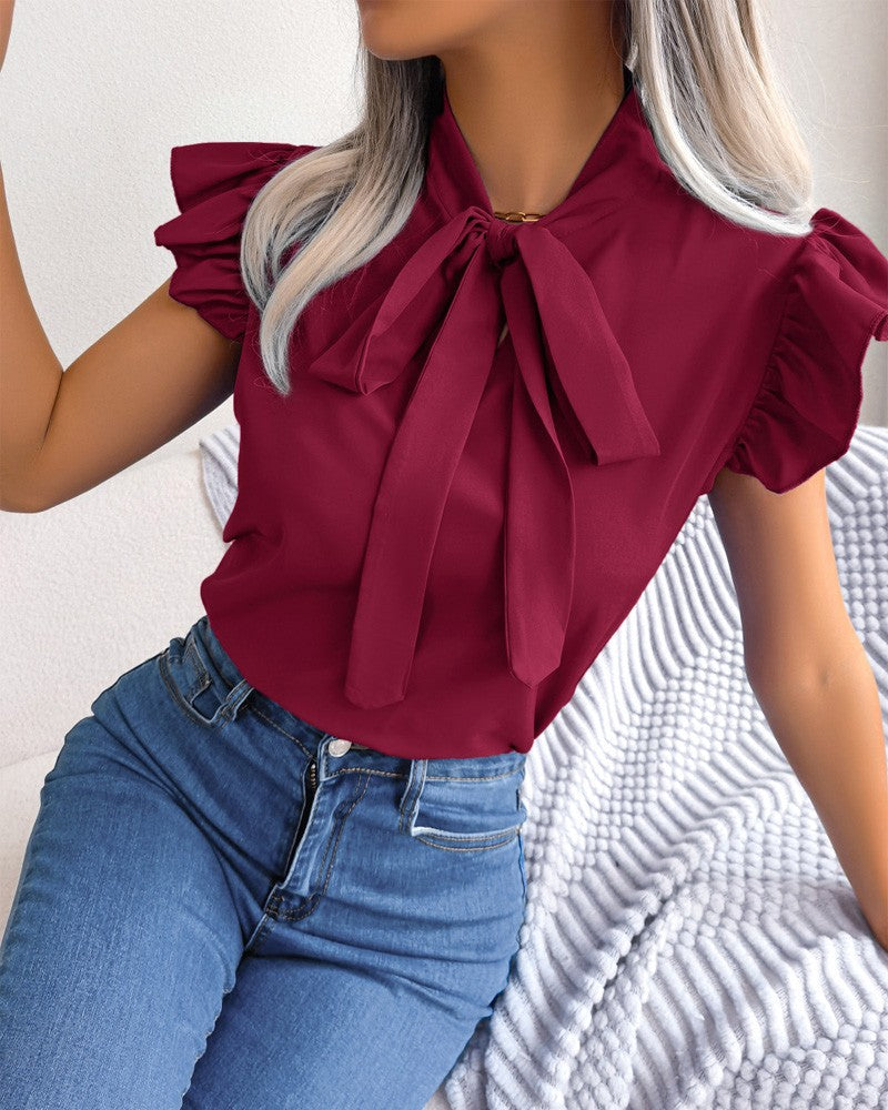 Women's Blouse with Ruffle Details and Chic Bow Element