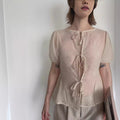 Women's Blouse with Decorative Lace-Up Details and Airy Sleeves