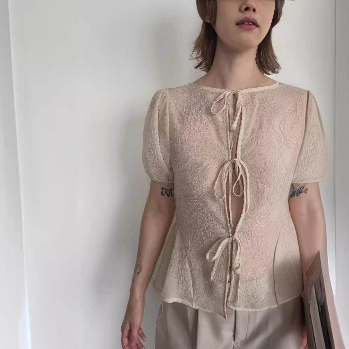 Women's Blouse with Decorative Lace-Up Details and Airy Sleeves
