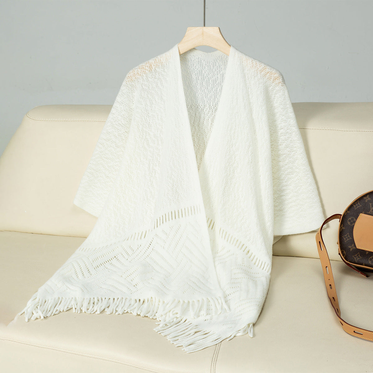 Elegant Knit Poncho with Fringed Details and Pattern